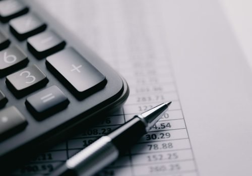 Calculator and stationery items on the table. Accounting concept Calculator and stationery items on the table. Accounting concept
